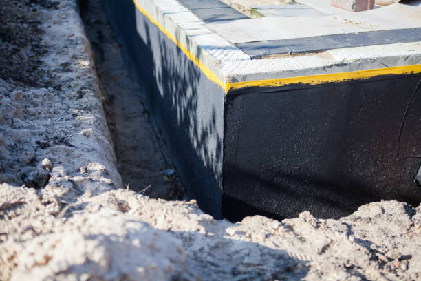 Professional Basement Waterproofing technician working in Coosada, AL